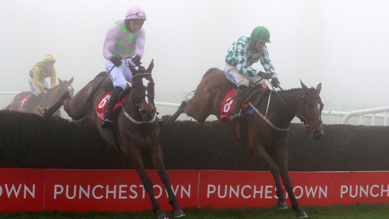 Min (left) and Tornado Flyer jump the last in the John Durkan