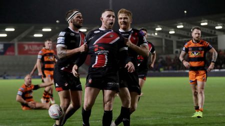 Jackson Hastings of Salford celebrates after scoring a try