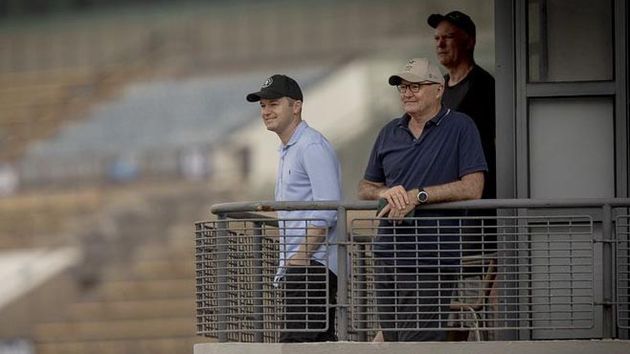 Ben Hayes (left) watches Mr Brightside at trackwork (Alex Evers for Hong Kong Jockey Club)