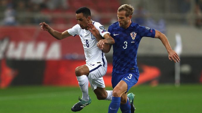 Ivan Strinic of Croatia tackles Zeca of Greece