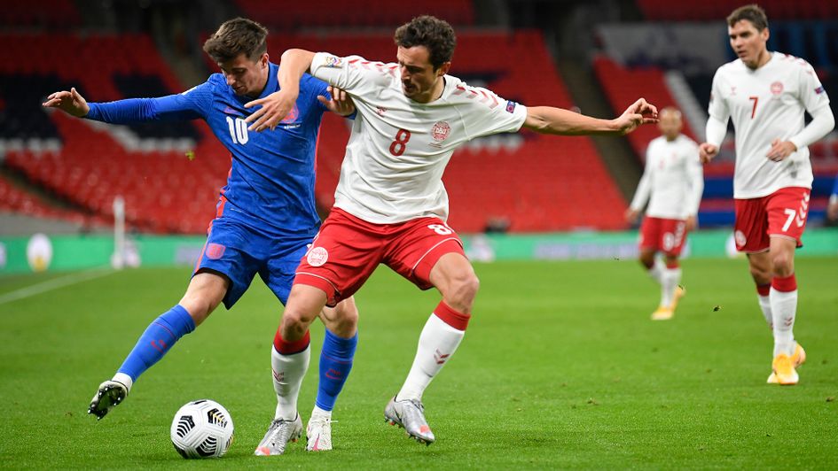 Mason Mount and Thomas Delaney battle for the ball