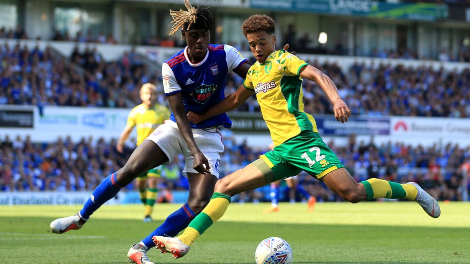 Jamal Lewis (right) in action for Norwich against Ipswich