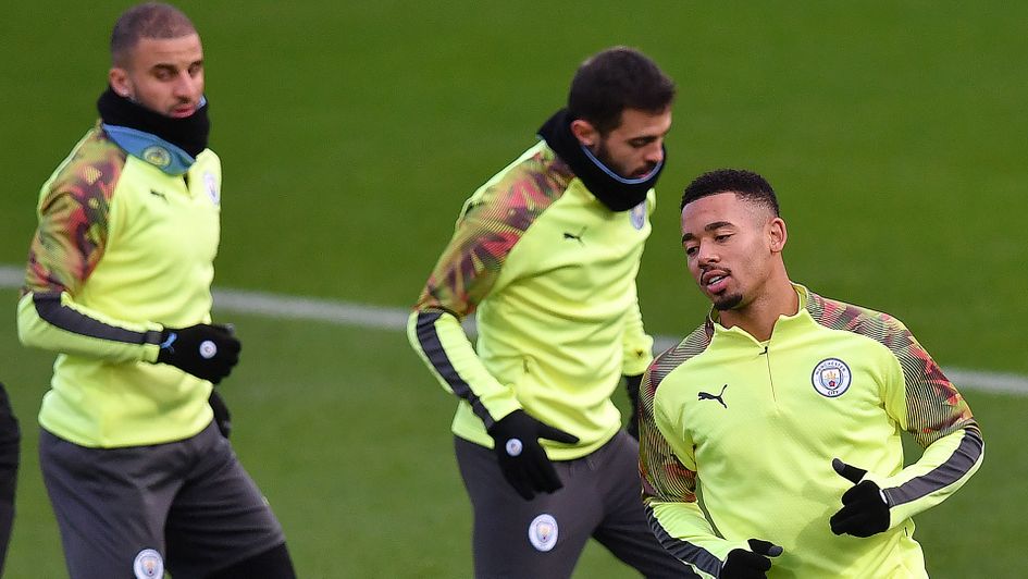 Manchester City's Kyle Walker, left and Gabriel Jesus, far fight, have tested positive for Covid-19