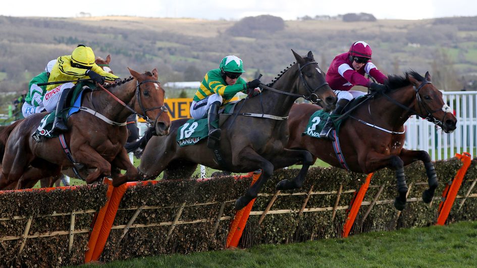 Saint Roi (centre) jumps to the front in the County Hurdle