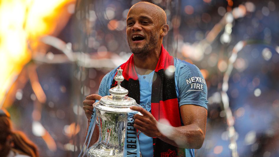 Vincent Kompany celebrates with the FA Cup