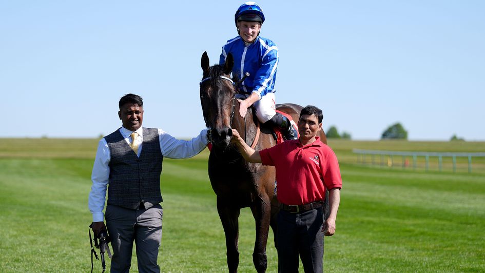 Tom Marquand gives Santorini Star a pat down the neck after winning the Betfred Jockey Club Stakes