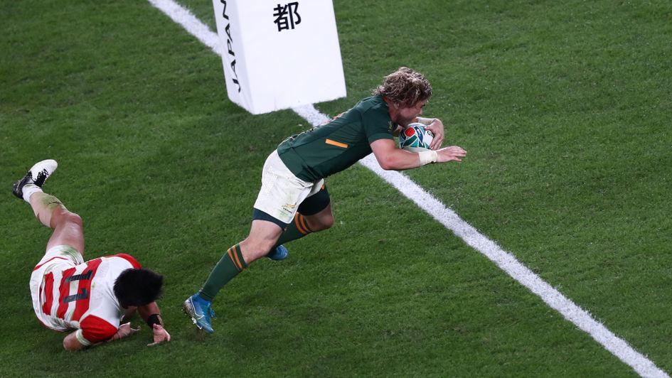 South Africa's scrum-half Faf de Klerk scores a try