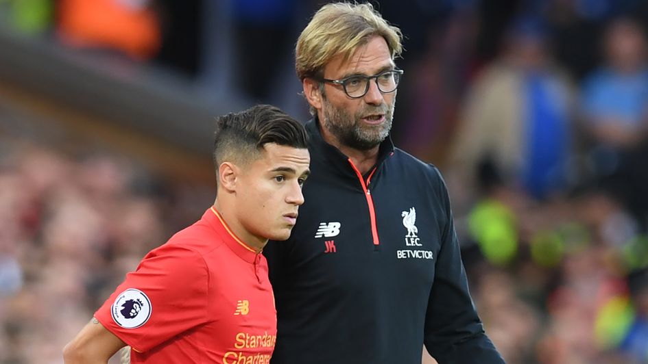 Philippe Coutinho (l) and Jurgen Klopp