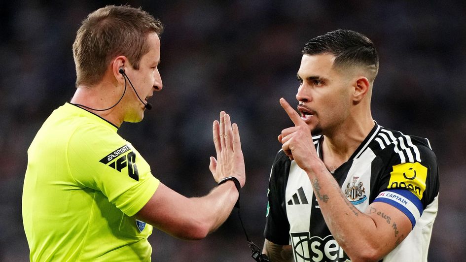 Bruno Guimaraes speaks to the referee