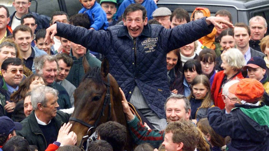 Tommy Carberry celebrates with Grand National winner Bobbyjo in their village of Ratoath