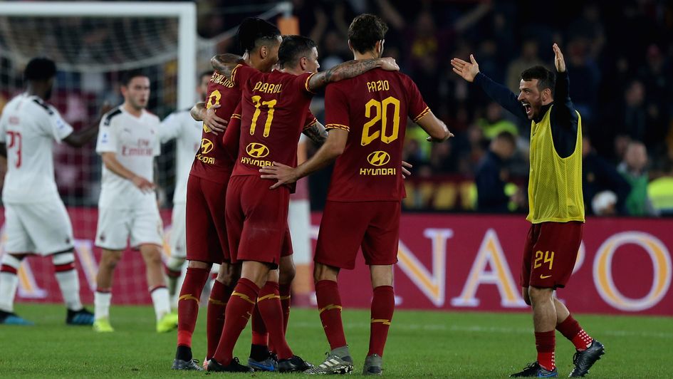 Roma celebrate a dramatic win at the San Siro