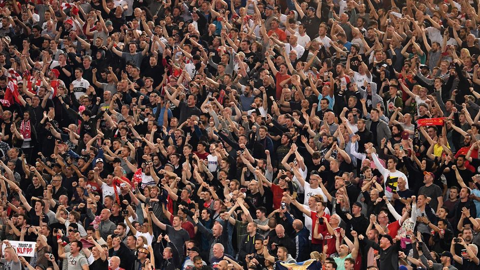 Liverpool fans celebrate after they reached the Champions League final