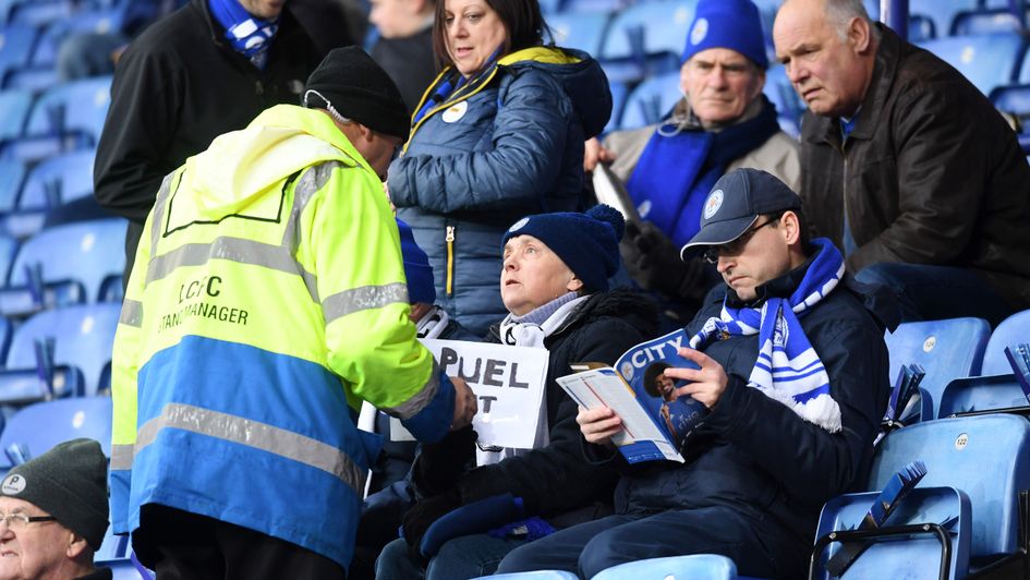 'PUEL OUT': A Leicester City fan has a sign taken off them ahead of their clash with Southampton