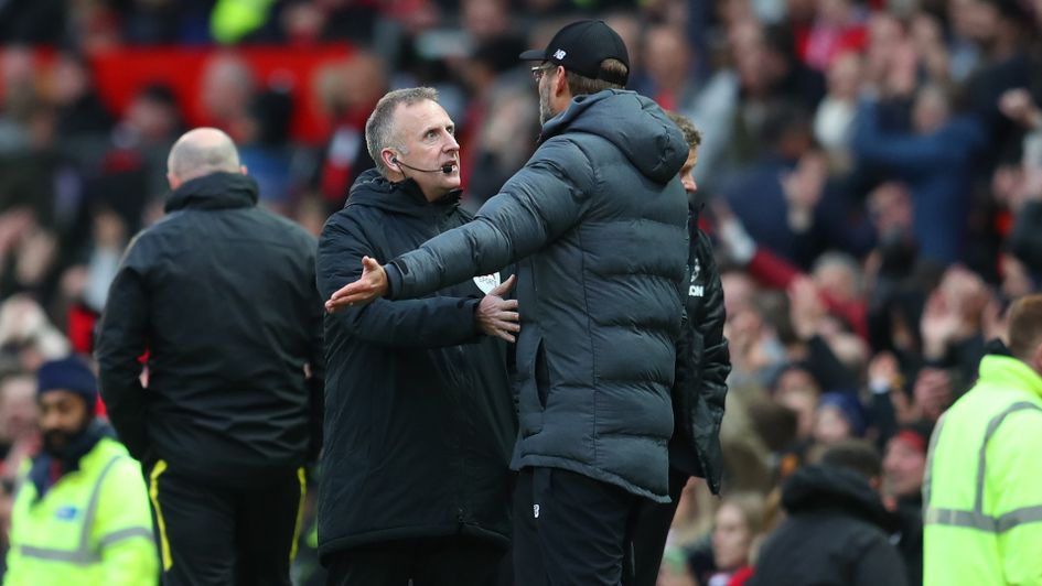Jurgen Klopp in discussion with fourth official Jonathan Moss