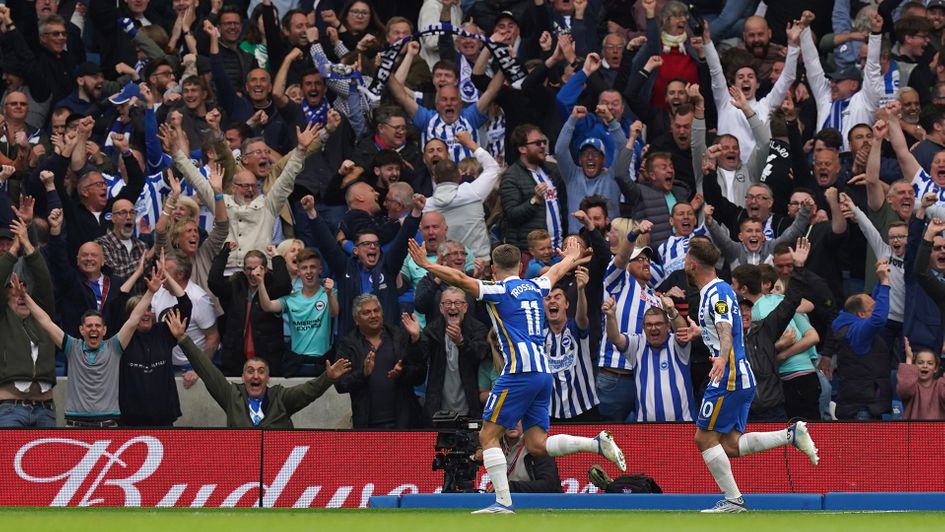 Leandro Trossard celebrates his goal against Manchester United