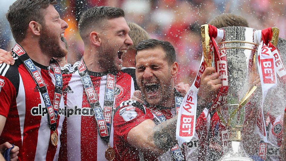 Billy Sharp lifts the Sky Bet League One trophy