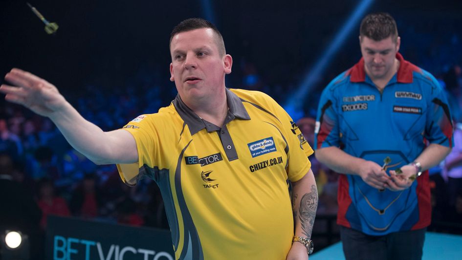 Dave Chisnall in action against Daryl Gurney (Picture: Lawrence Lustig/PDC)