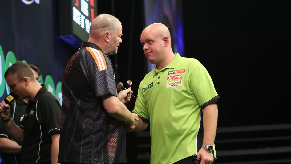 Barney and MVG shake hands at the Champions League of Darts (Pic: Lawrence Lustig)