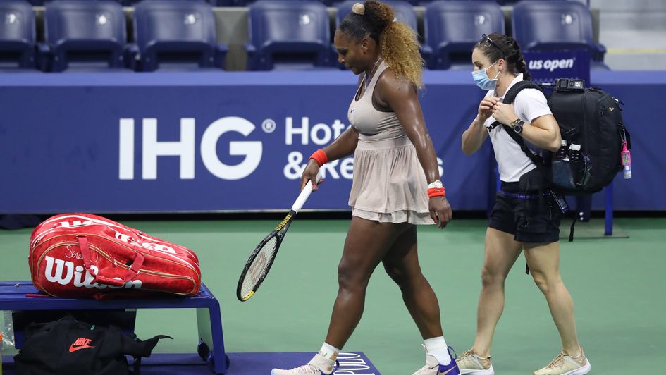 Anguish: Serena Williams heads for the exit