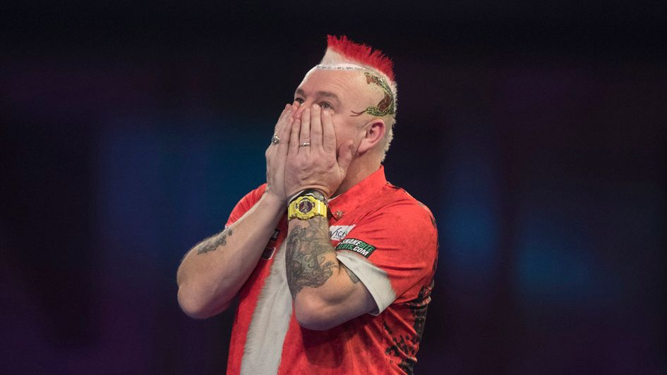 Peter Wright crashed out at the first hurdle (Picture: Lawrence Lustig/PDC)