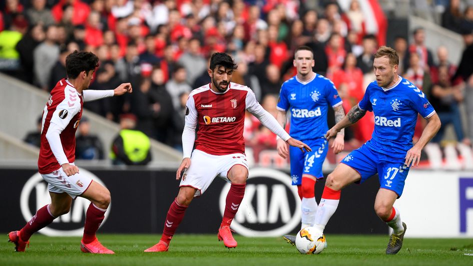 Scott Arfield looks to beat the Braga players