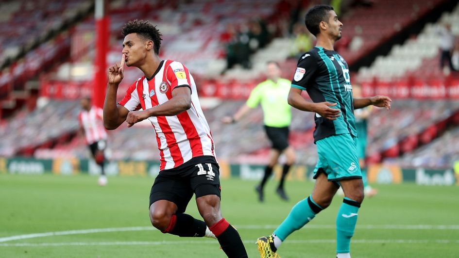 Ollie Watkins celebrates scoring against Swansea