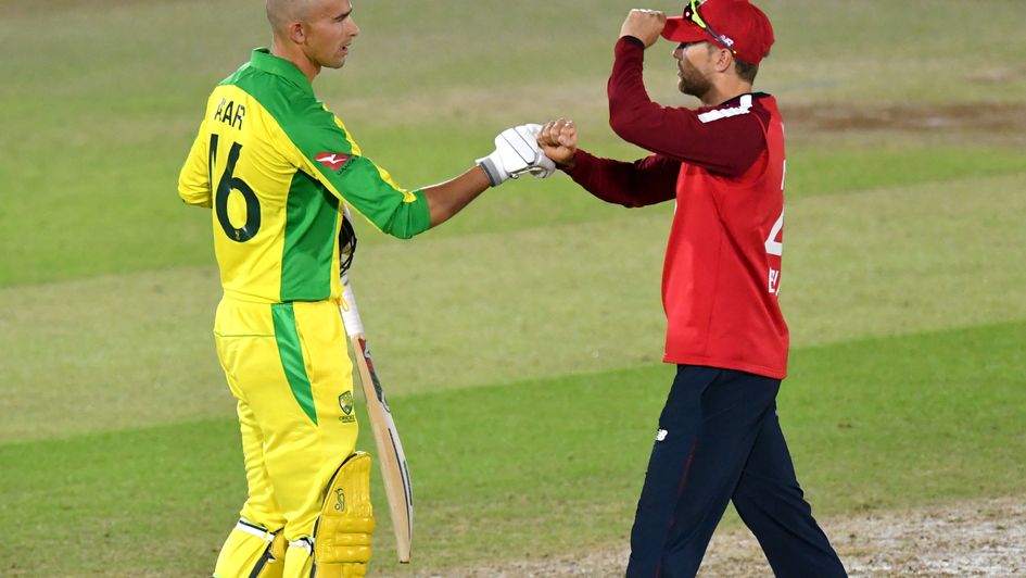 Ashton Agar (left) and Joe Denly bump fists as Australia celebrate victory over England