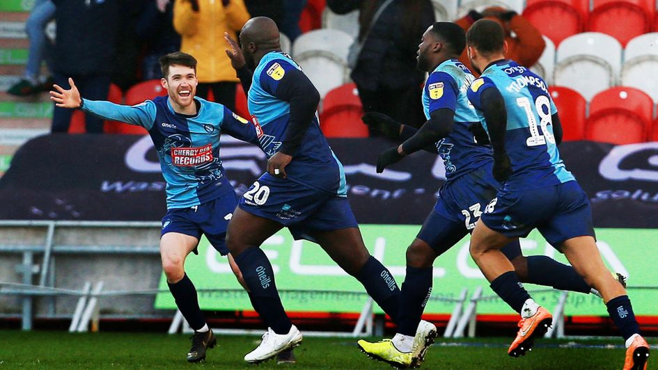 Adebayo Akinfenwa celebrates a goal for Wycombe