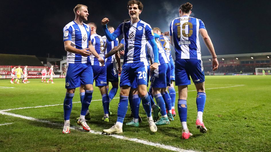 Wigan celebrate a goal.