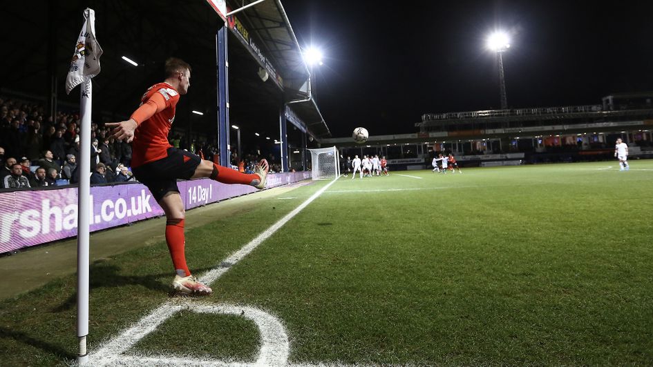 Luton's James Bree takes a corner kick