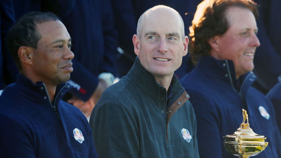 Jim Furyk between two of his biggest stars