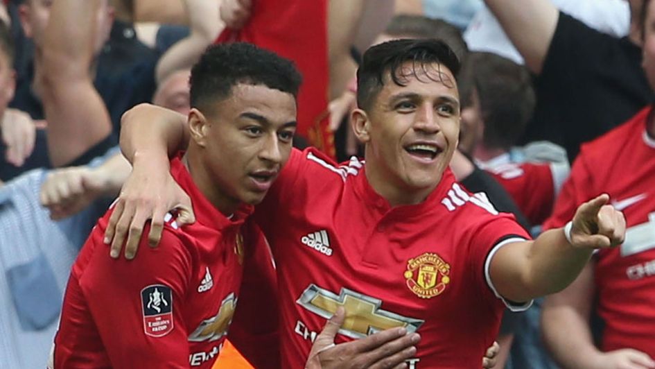 Alexis Sanchez celebrates with Jesse Lingard