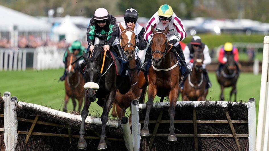 Strong Leader (left) on his way to Liverpool Hurdle success