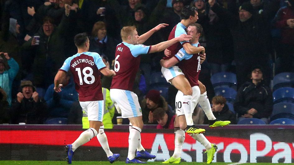 Burnley players celebrate their goal against Liverpool