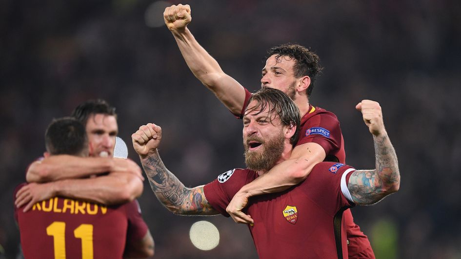 Roma players celebrate their win over Barcelona in the Champions League