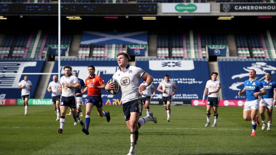 Scotland's Huw Jones runs through to score their fourth try