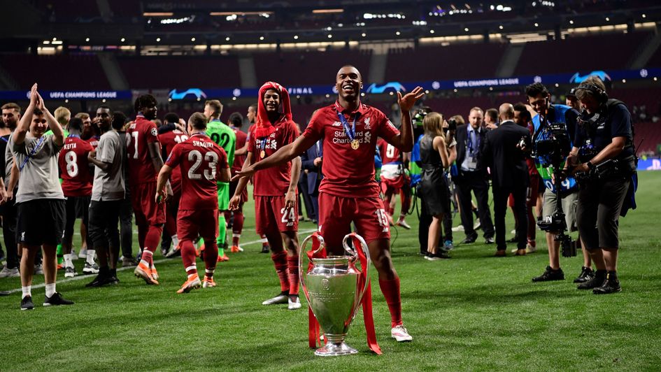 Daniel Sturridge: The striker performs his signature dance move with the Champions League trophy after Liverpool's win