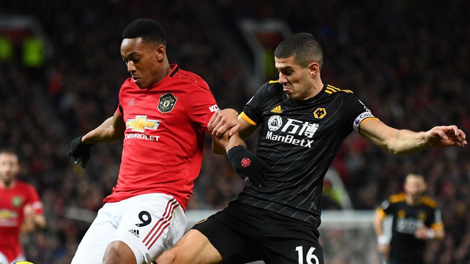 Conor Coady and Anthony Martial during Man Utd v Wolves