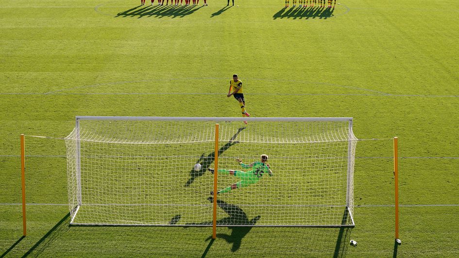 Oxford's John Mousinho scores during their penalty shootout win