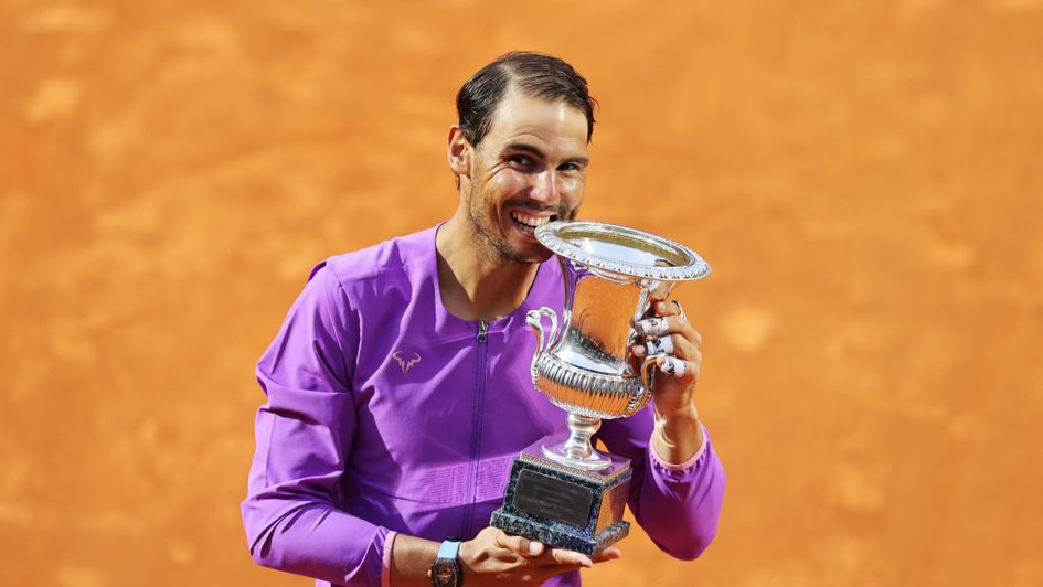 Rafael Nadal celebrates with the trophy after winning the final over Novak Djokovic