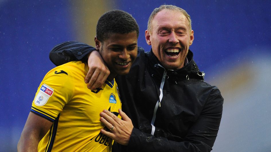 Steve Cooper celebrates with Rhian Brewster