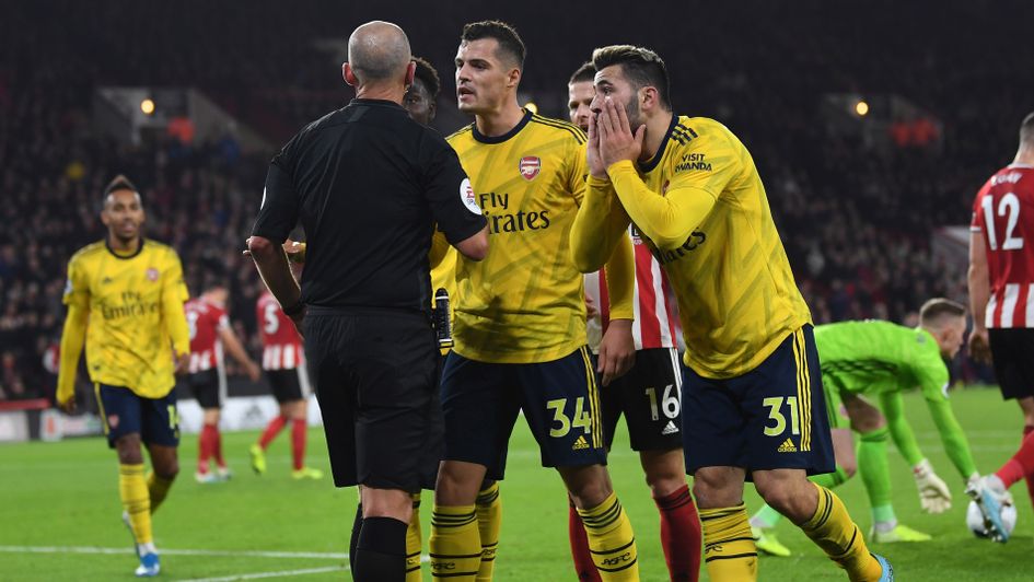 Granit Xhaka: Arsenal midfielder (centre, number 34) addresses referee Mike Dean during the defeat at Sheff United