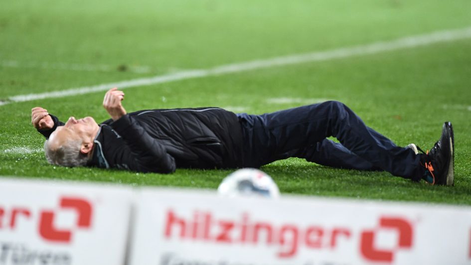 Christian Streich is barged to the floor
