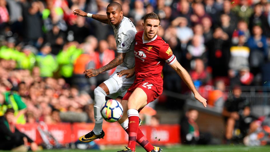 Ashley Young and Jordan Henderson battle for the ball