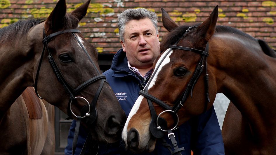 Paul Nicholls poses with Denman (left) and Kauto Star
