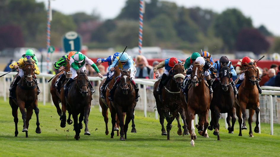 3/1 favourite Bacio (white cap) wins the City Of Troy Nunthorpe Stakes at York