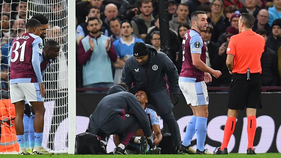 Aston Villa's Ollie Watkins is treated by the physio