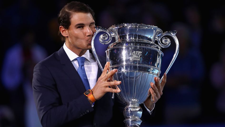 Rafael Nadal gets to grips with the year-end no 1 trophy