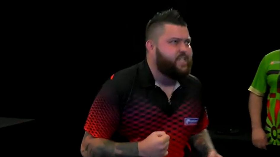 Michael Smith celebrates against Jose De Sousa