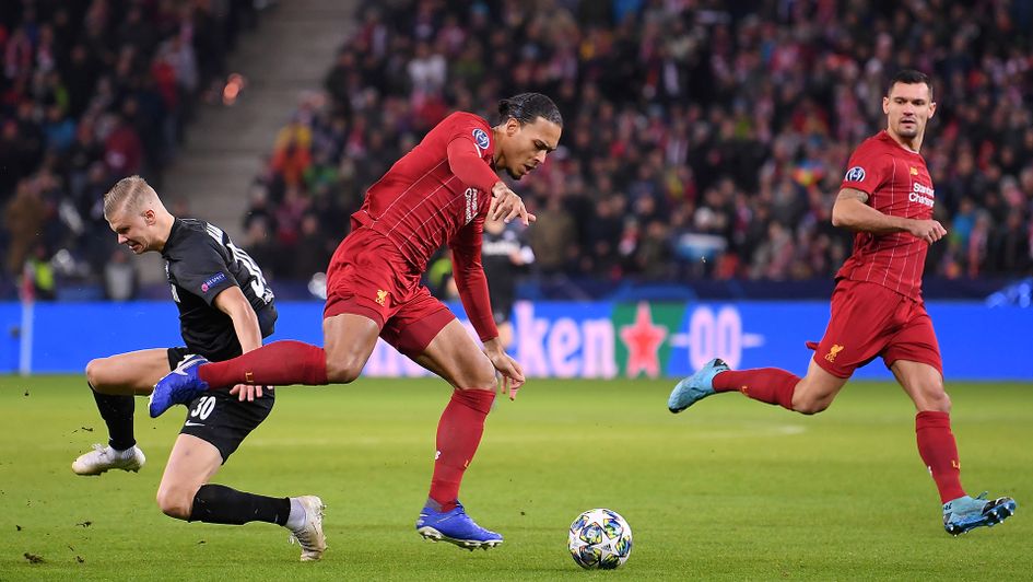 Erling Haaland looks to dispossess Virgil van Dijk